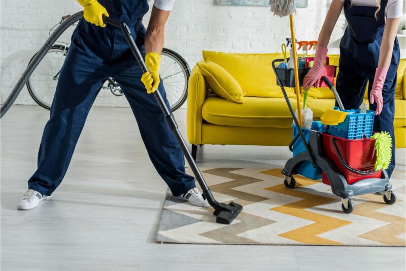 cropped-view-of-cleaners-in-overalls-cleaning-apar-2024-11-18-08-59-53-XXJP3SX-800x533